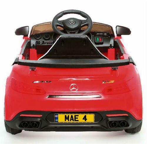 Rear of a child's red car with personlised number plate sticker on.