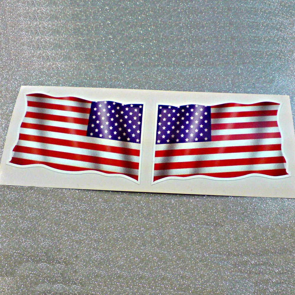 AMERICAN USA FLAGS STICKERS A wavy flag of America. 50 white stars on a blue field in the top left and a field of 13 alternating stripes in red and white.