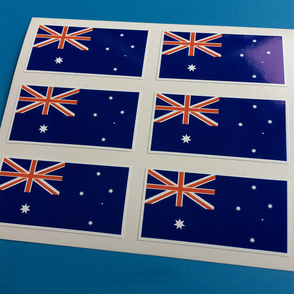 AUSTRALIAN FLAG STICKERS. Red, white and blue Union Jack in the top left hand corner. One white star under the flag. Five stars to the right of the flag. Blue background.