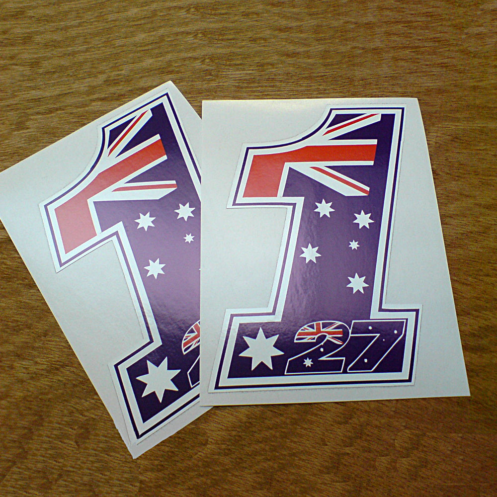 CASEY STONER 27 NO 1. The Australian flag; a blue field with a Union Jack and five white stars in the shape of the numbers 1 and 27. The number 27 is at the base of and within the number1.