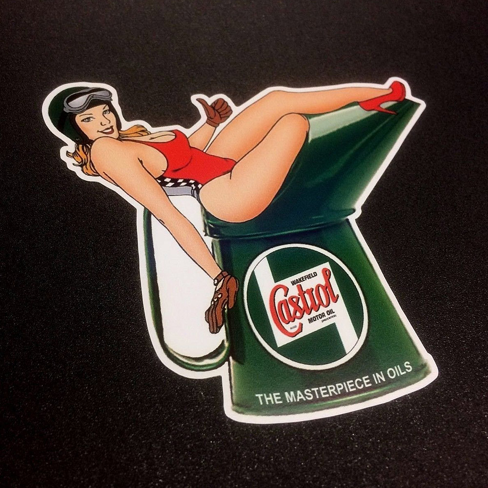 CASTROL OIL POURING JUG AND MODEL STICKER. Green Castrol Oil jug with Castrol Wakefield logo at the front. Model wearing a red swimsuit is sat on top of the jug. Additional text The Masterpiece In Oils is at the bottom.