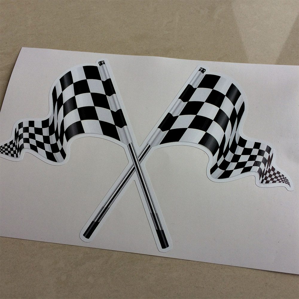 CROSSED CHEQUERED FLAGS STICKERS. Black and white crossed chequered flags on poles blowing in the wind.