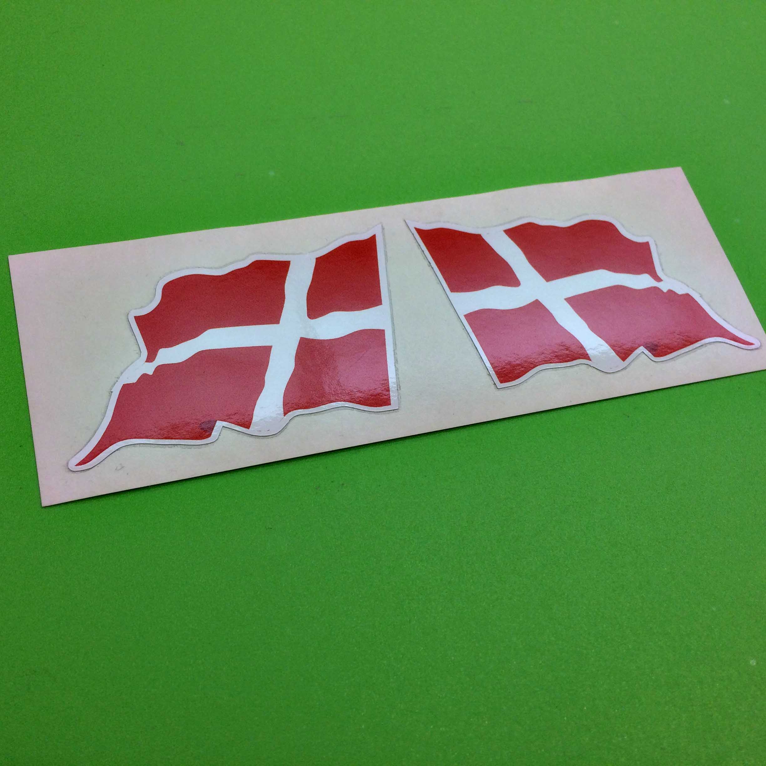 DENMARK FLAG WAVEY STICKERS. A wavy flag of Denmark. A white cross on a red background.
