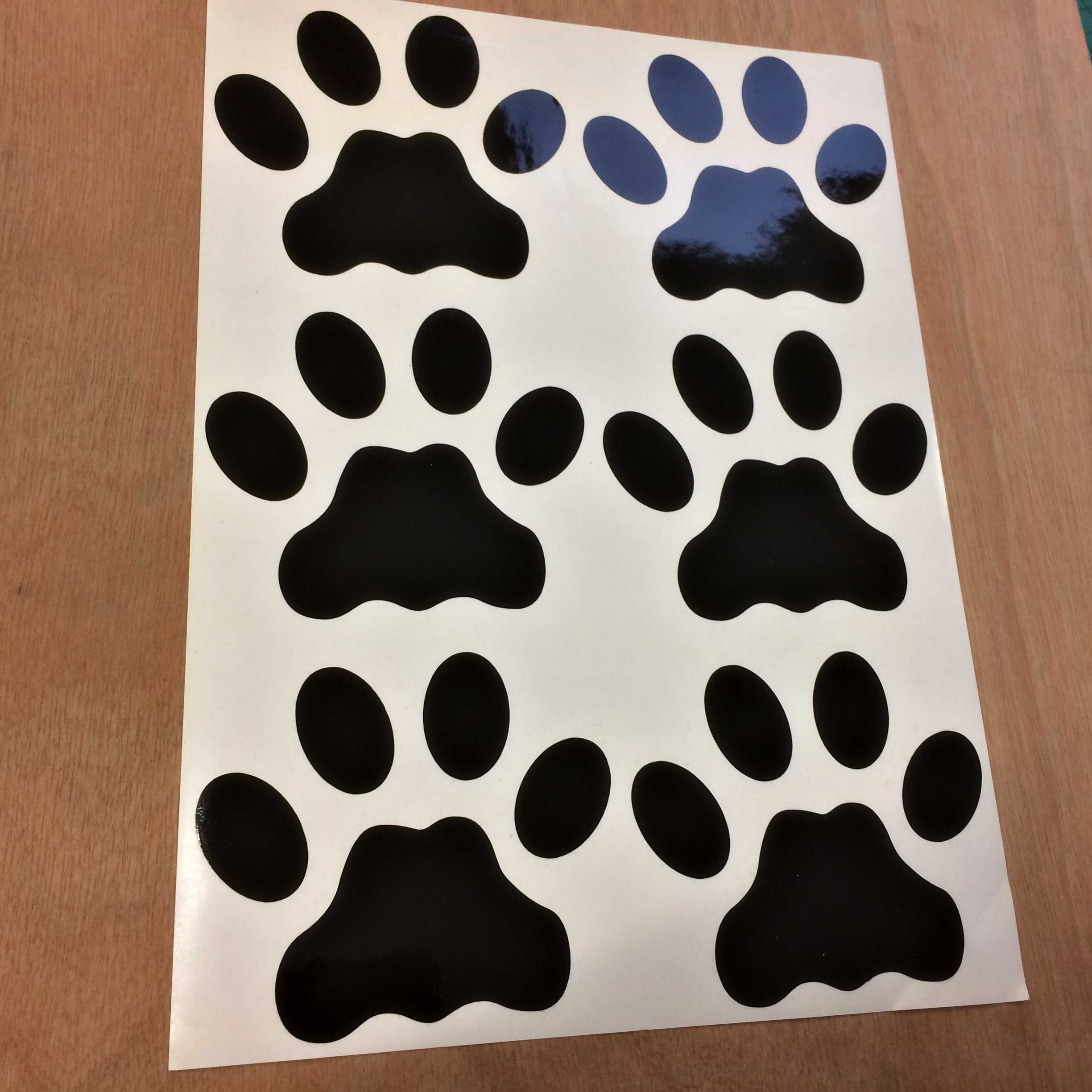 Dog paw prints in black.