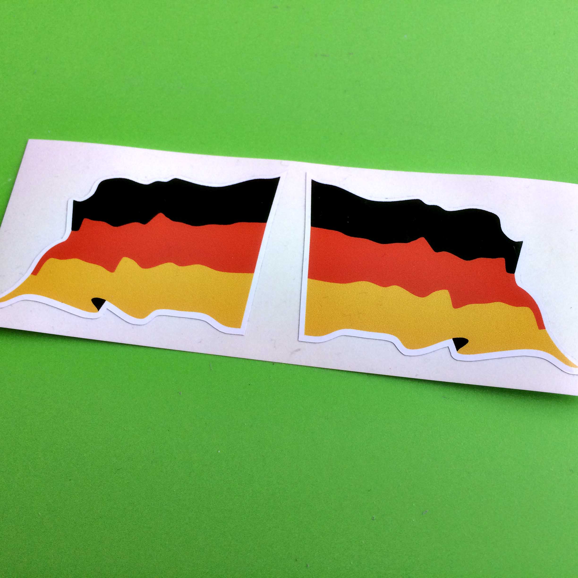 GERMAN GERMANY WAVY FLAG STICKERS. A wavy flag of Germany. Three horizontal bands of black, red and gold.
