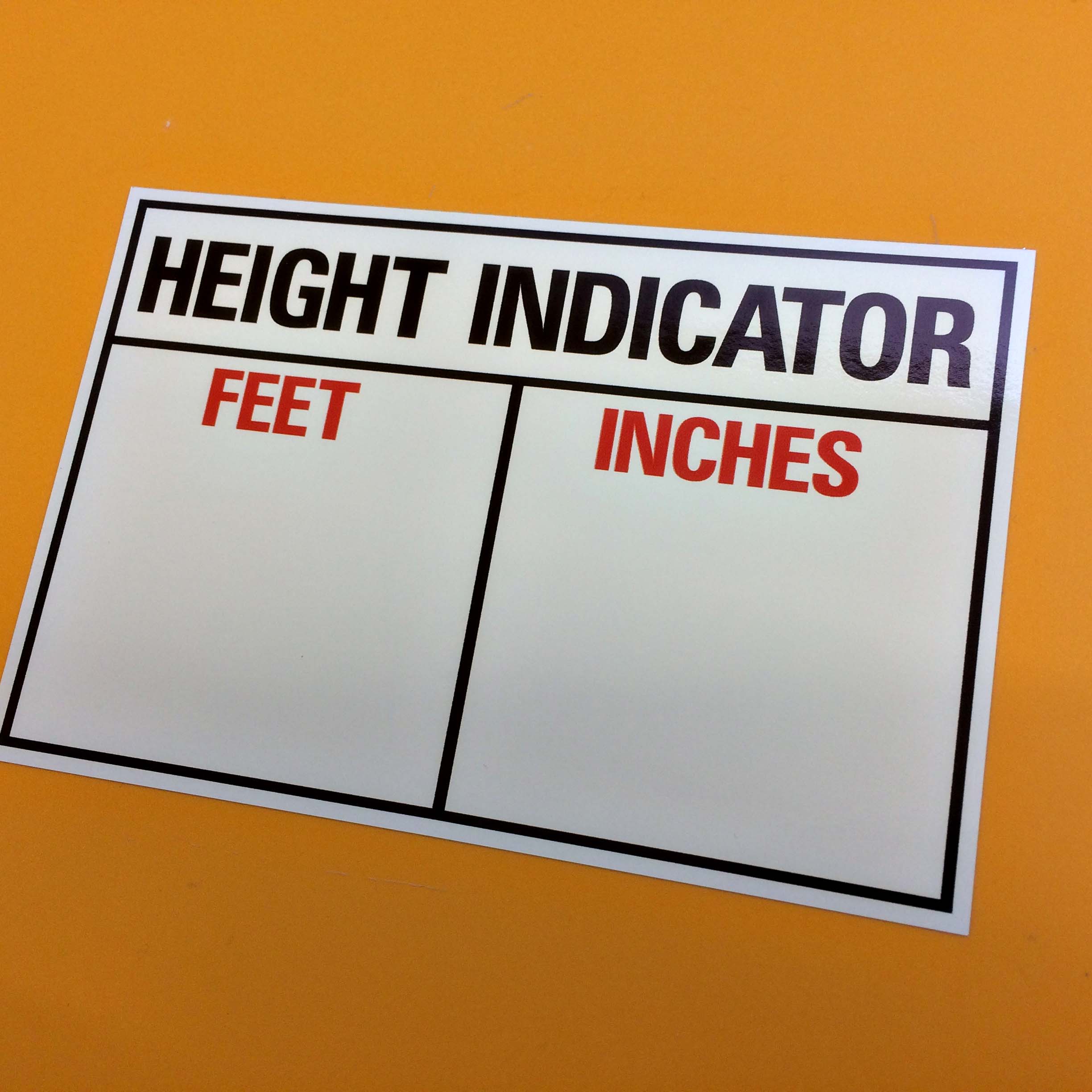 COMMERCIAL VEHICLE CAB HEIGHT INDICATOR HGV STICKER IMPERIAL ONLY. Height Indicator in black lettering on a white sticker. Below are two columns Feet and Inches in red uppercase lettering.