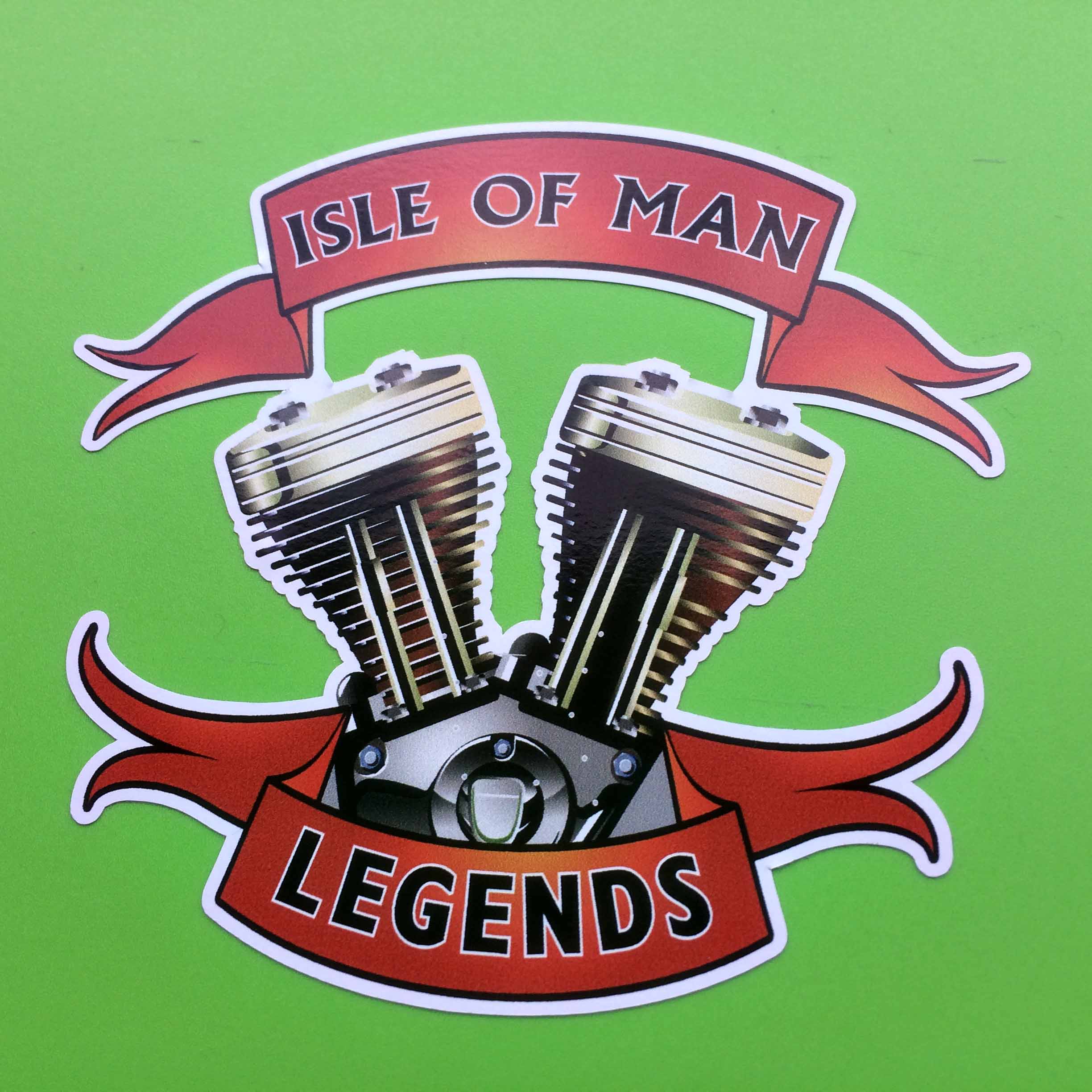 ISLE OF MAN LEGENDS STICKERS. Isle Of Man Legends in black lettering on two red banners. An image of a V block crankcase sits between the banners.