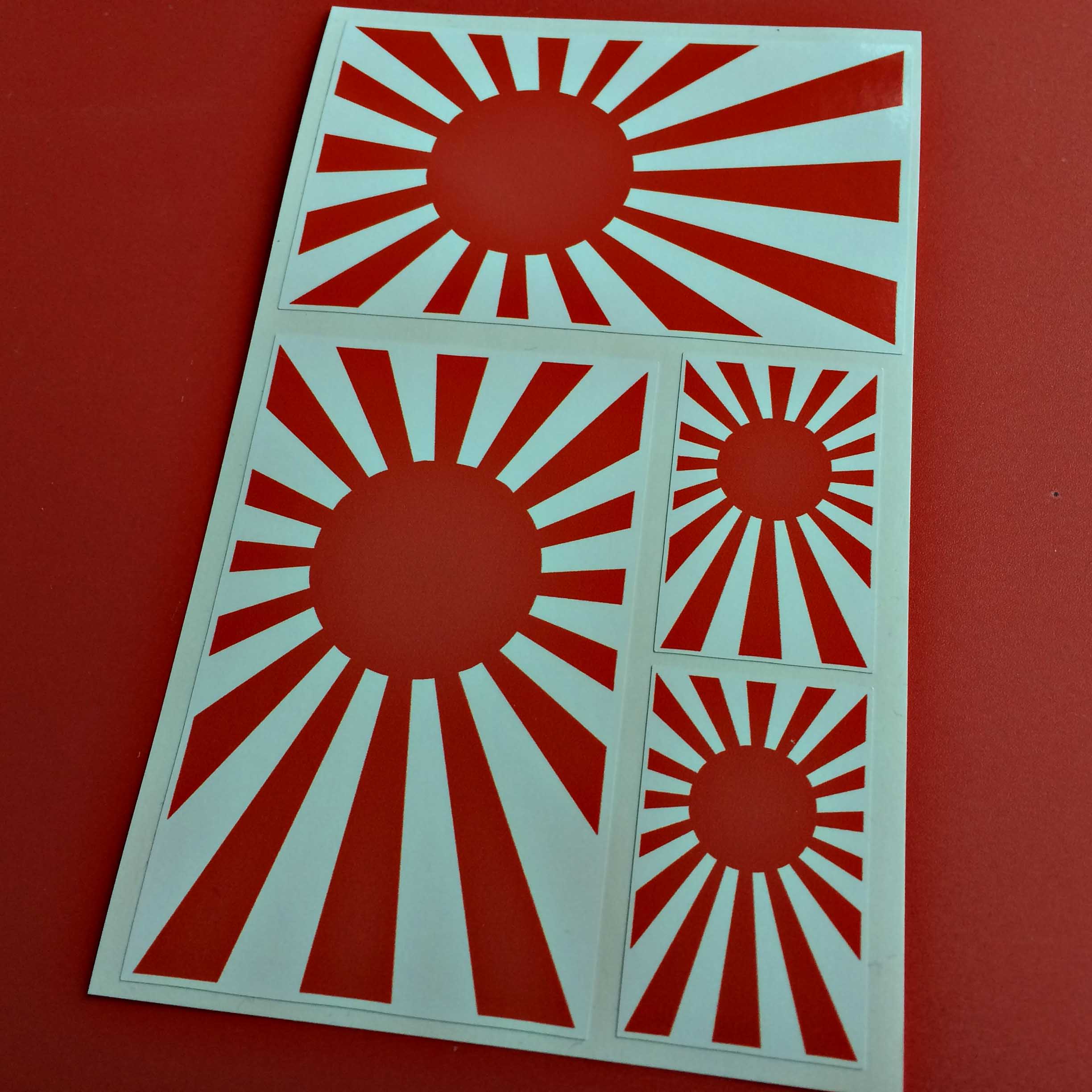 JAPANESE RISING SUN STICKERS. The Rising Sun consists of a red disc and sixteen red rays emanating from the disc.