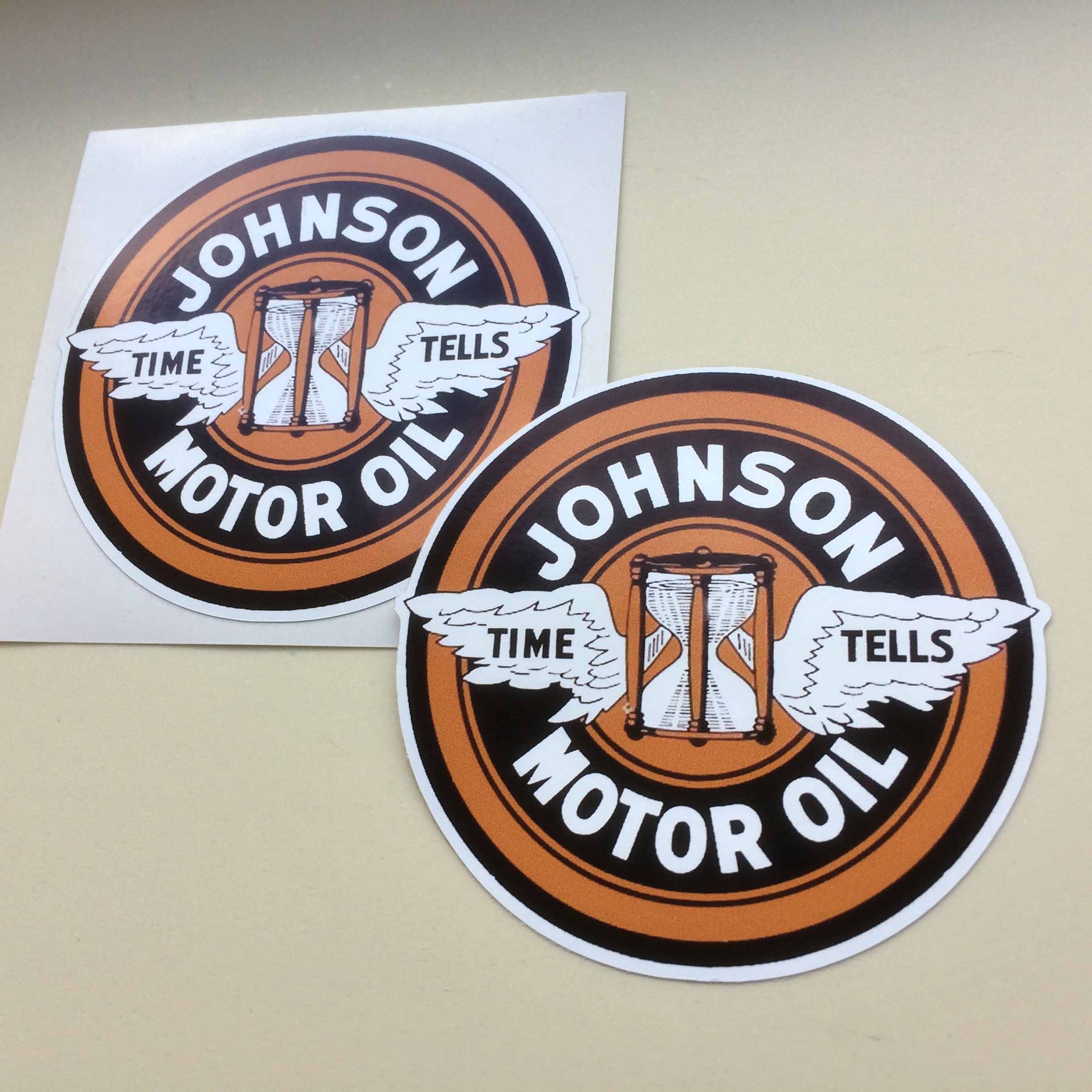 JOHNSON MOTOR OIL STICKER. Johnson Motor Oil in white lettering surrounds an hourglass with white wings emblazoned with Time Tells. On a background of concentric circles in brown and black.