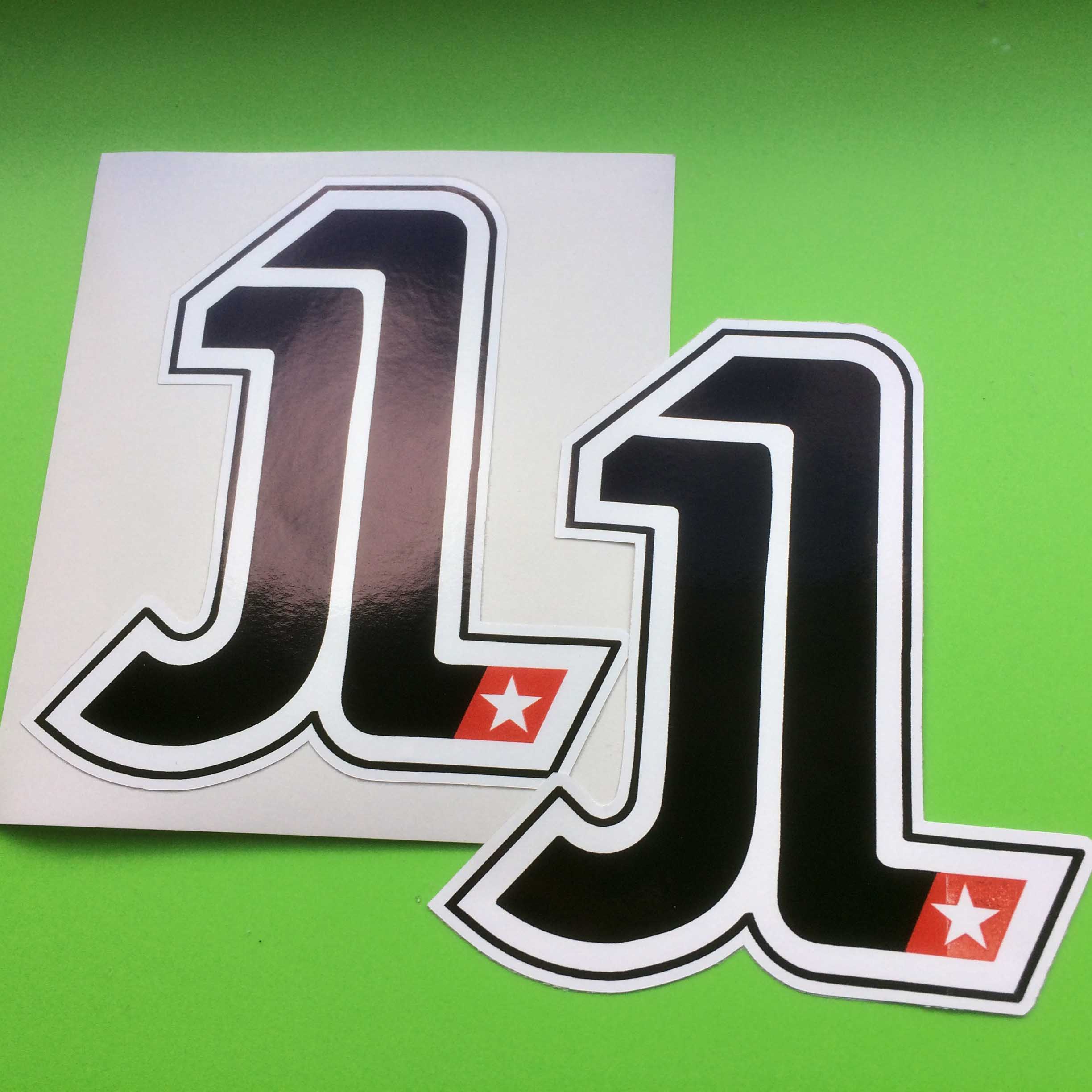 JL in bold black letters. The base of the L is partially red with a white star on it.