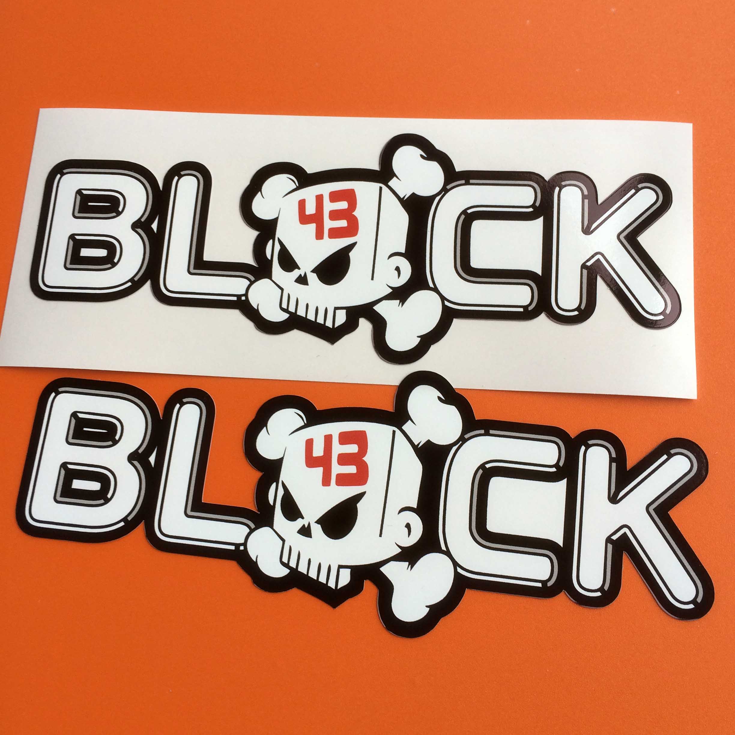 KEN BLOCK RALLY STICKERS. Block in white lettering edged in black. A white skull and crossbones with the number 43 in red on the forehead replaces the letter O in Block.