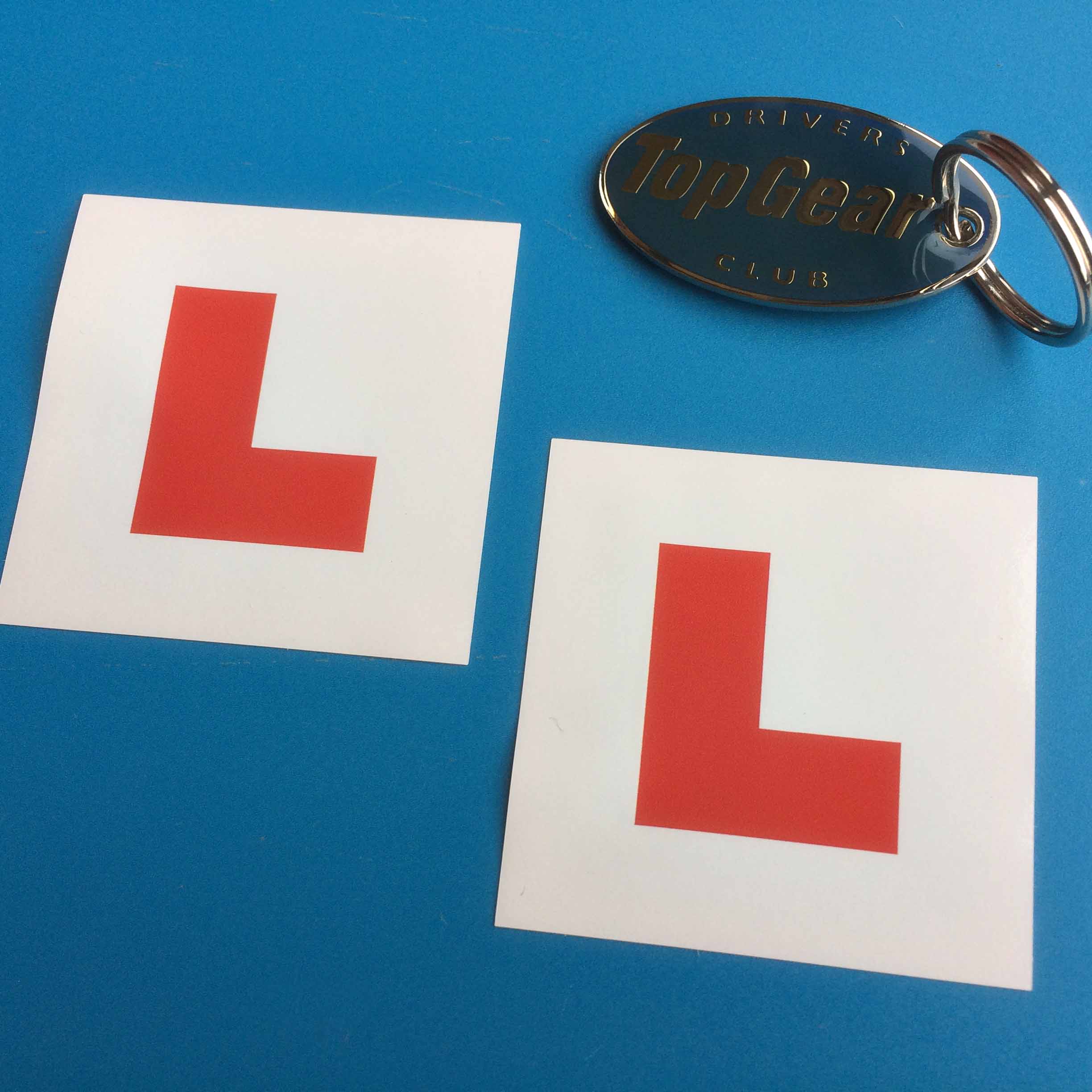 CHILD'S L PLATE STICKERS. Capital L in red on a white background.