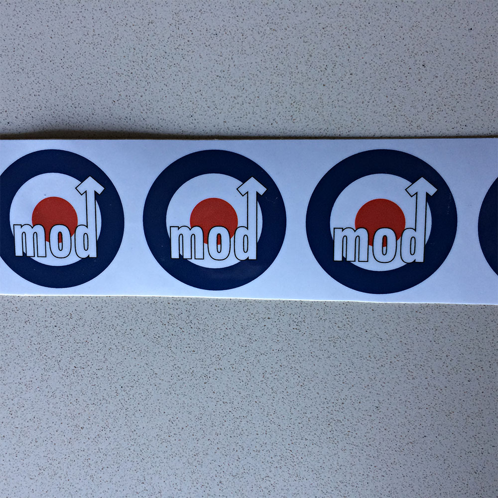 MOD DECORATIVE SCOOTER TAPE. Red, white and blue roundel of the RAF. At the bottom in white lettering is the word mod. Letter d is in the shape of an arrow.