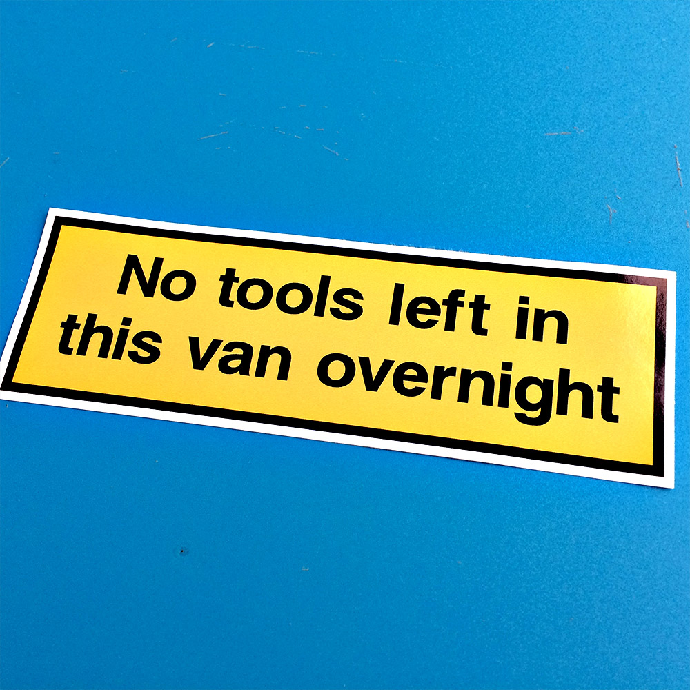 NO TOOLS LEFT IN THIS VAN STICKER. No tools left in this van overnight. Black lettering on a yellow background with a black border.