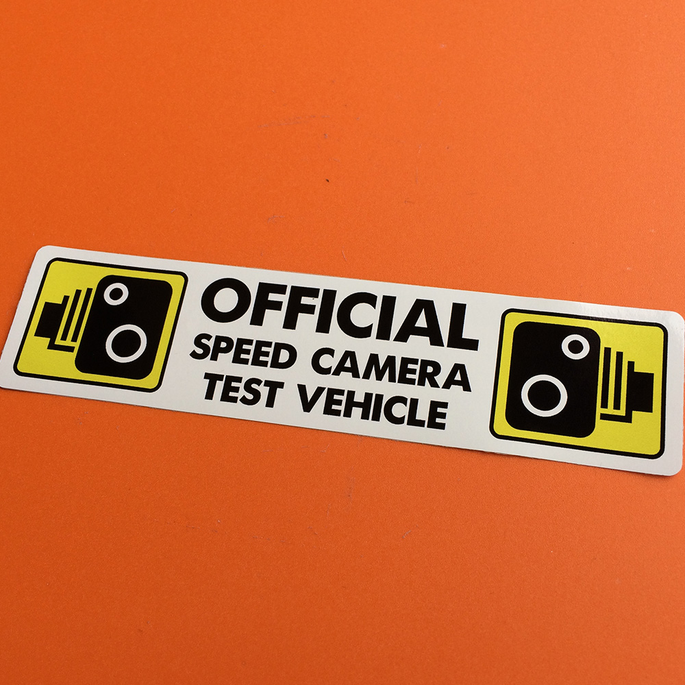OFFICIAL SPEED CAMERA TEST VEHICLE STICKER. Official Speed Camera Test Vehicle in black lettering. Yellow speed camera traffic warning sign either side of the text.