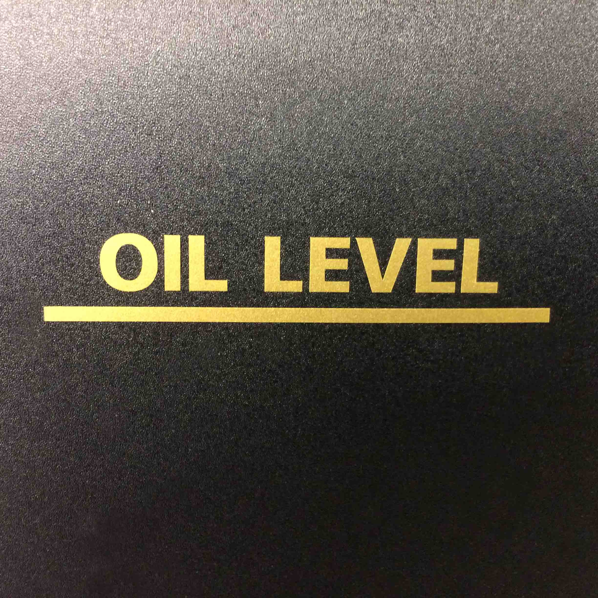 OIL LEVEL MARKER STICKER. Oil Level gold lettering and underlined in gold.