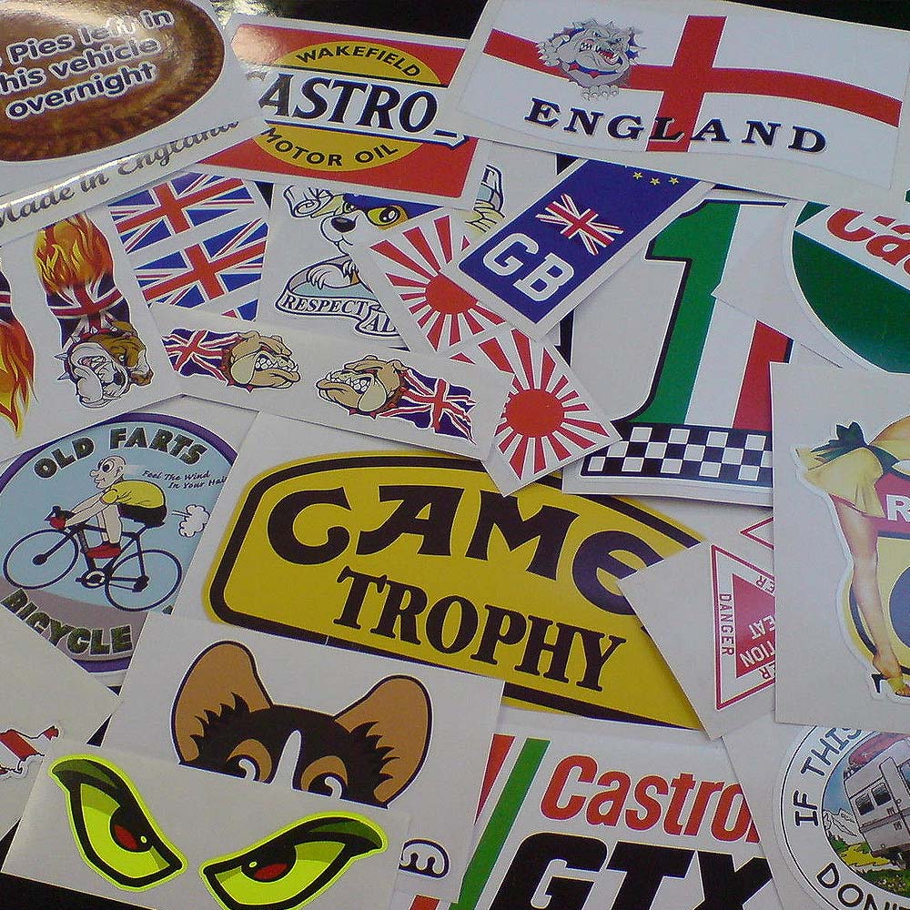 QUALITY SECONDS ASSORTED CAR STICKERS. An assortment of stickers.