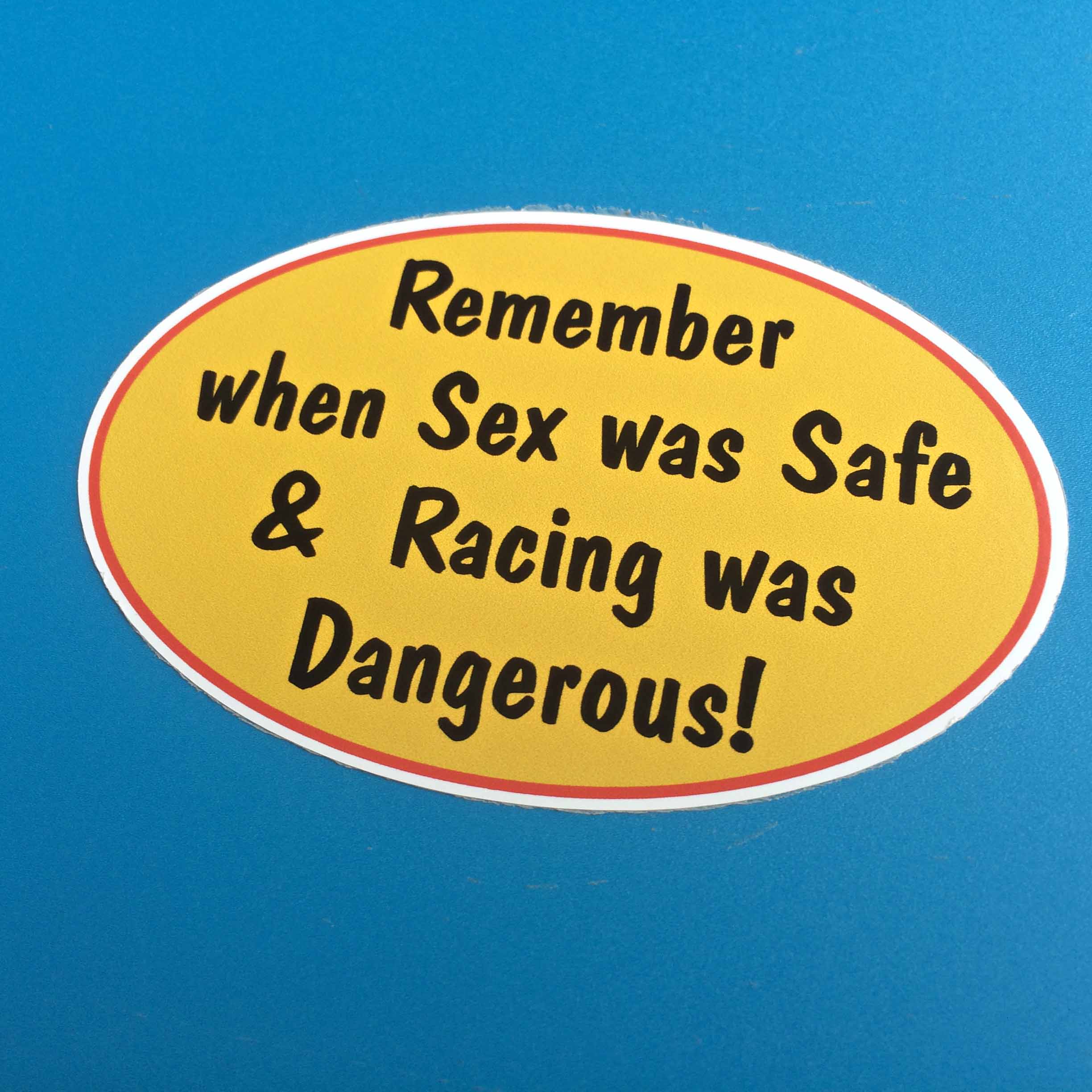 REMEMBER WHEN SEX WAS SAFE STICKER. Remember when Sex was Safe & Racing was Dangerous! Black lettering on a yellow oval background with a red border.
