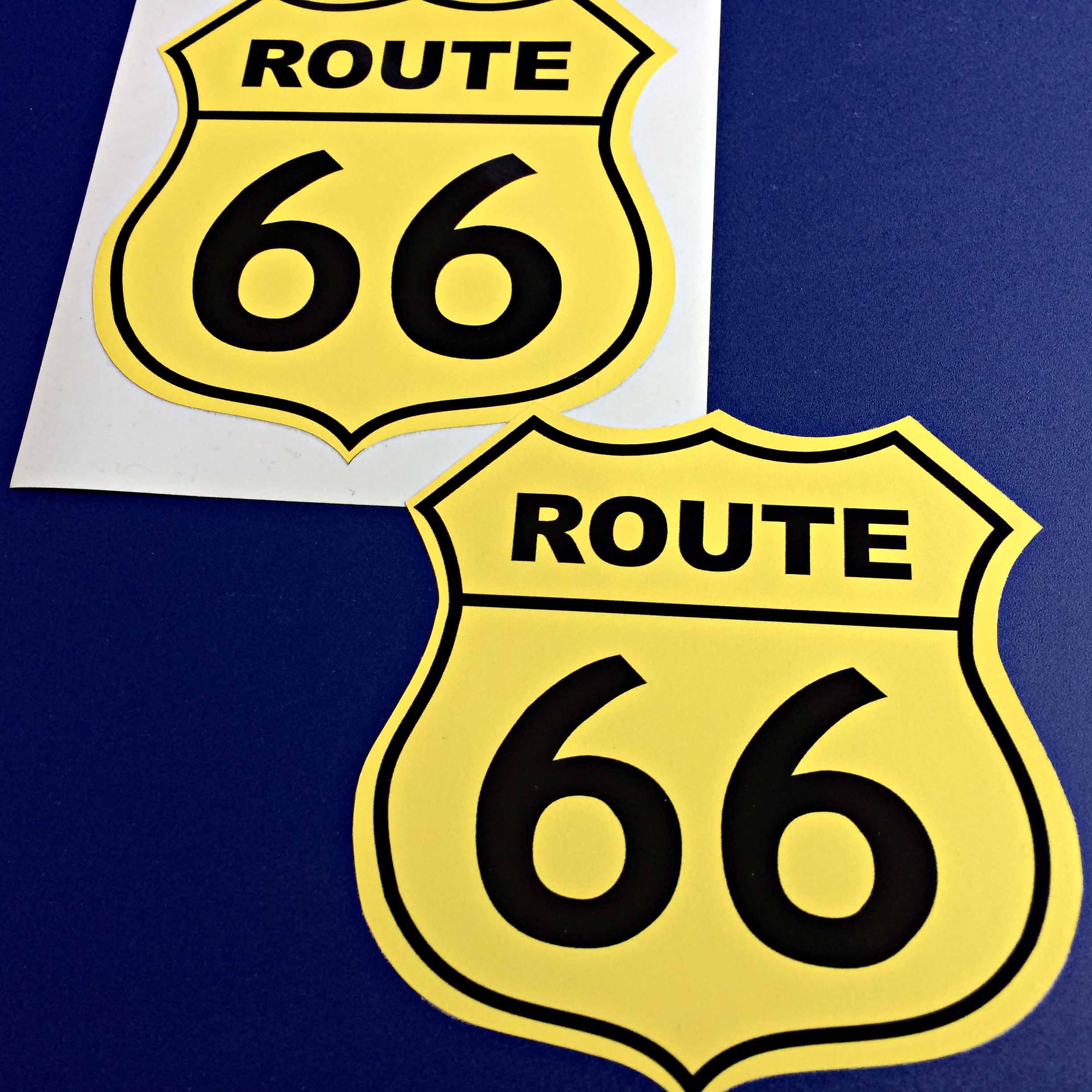 Route 66 in bold black lettering on a yellow Route 66 sign shaped sticker.