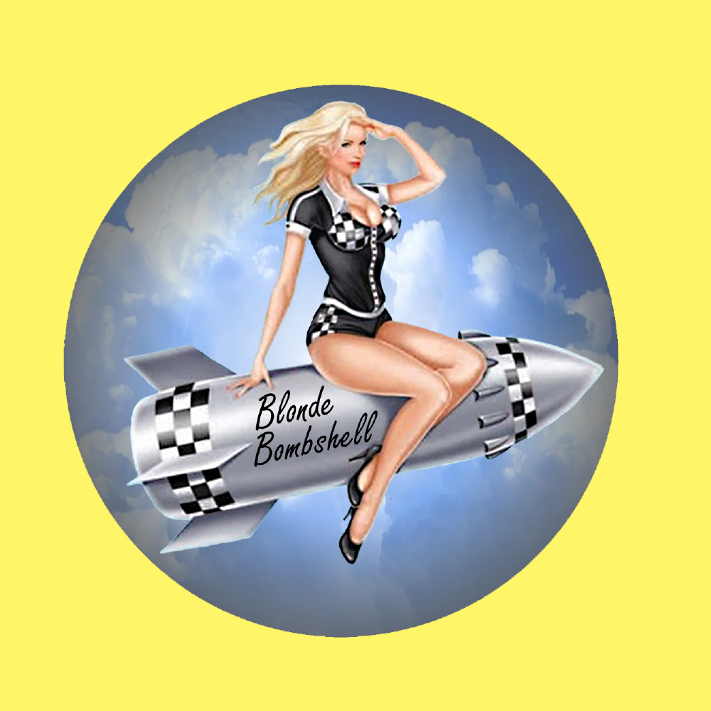 A silver rocket named Blonde Bombshell and with black and white chequer on the side flies through the air. A blonde model sits onboard wearing black heels and a black hot pants outfit with a black and white chequer bust.