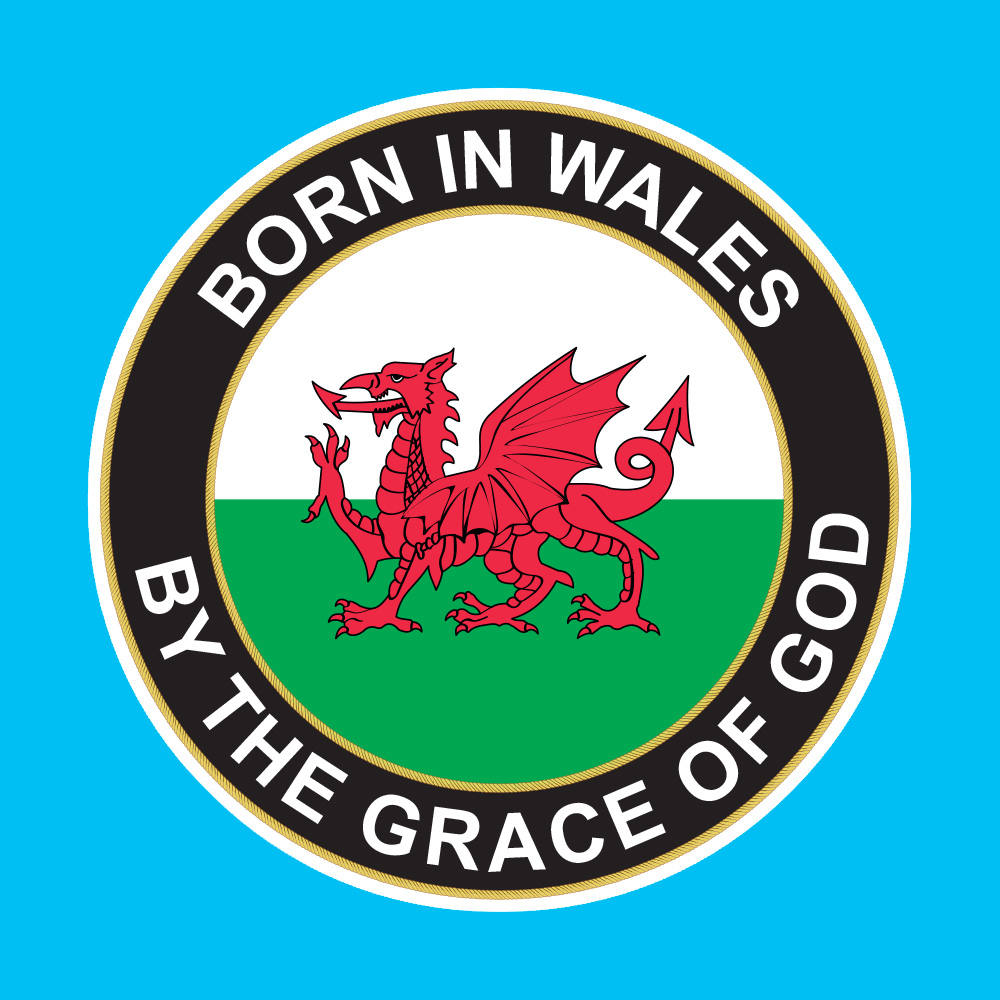 BORN IN WALES STICKER. Born In Wales By The Grace Of God in white uppercase lettering surrounds a black circular sticker with a yellow border. In the centre is a circular flag of Wales; a red dragon on a green and white field.