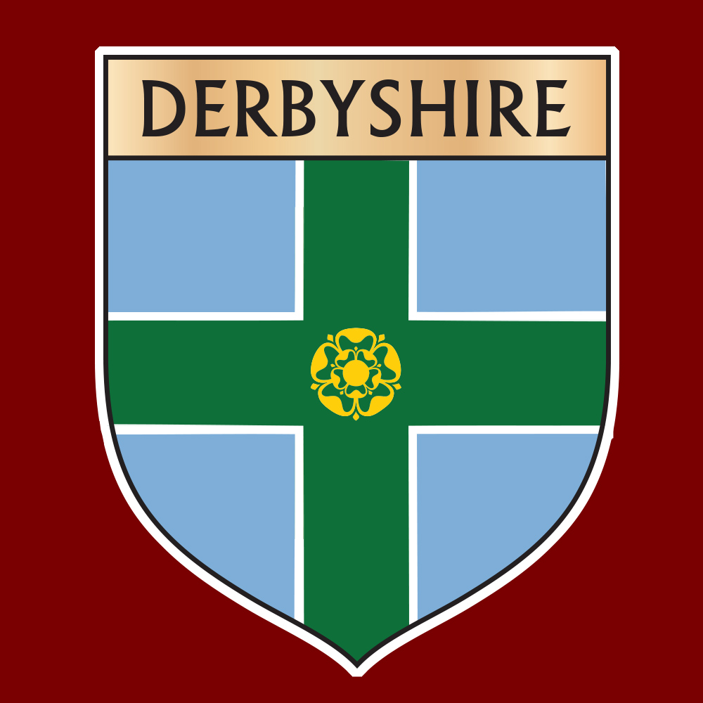 Derbyshire in black lettering on a banner across the top of the shield which features a green cross on a blue background. In the centre is a gold Tudor rose.