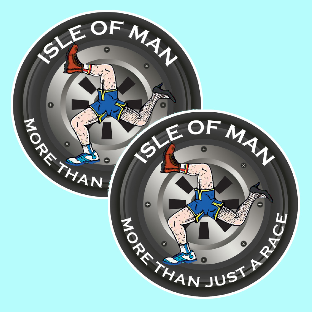 Isle Of Man More Than Just A Race white lettering surrounds the wheel of a motorbike. Centre is a triskelion wearing blue and yellow shorts. Two hairy legs are wearing a boot and a trainer. The third stockinged leg wears a woman's black stiletto.