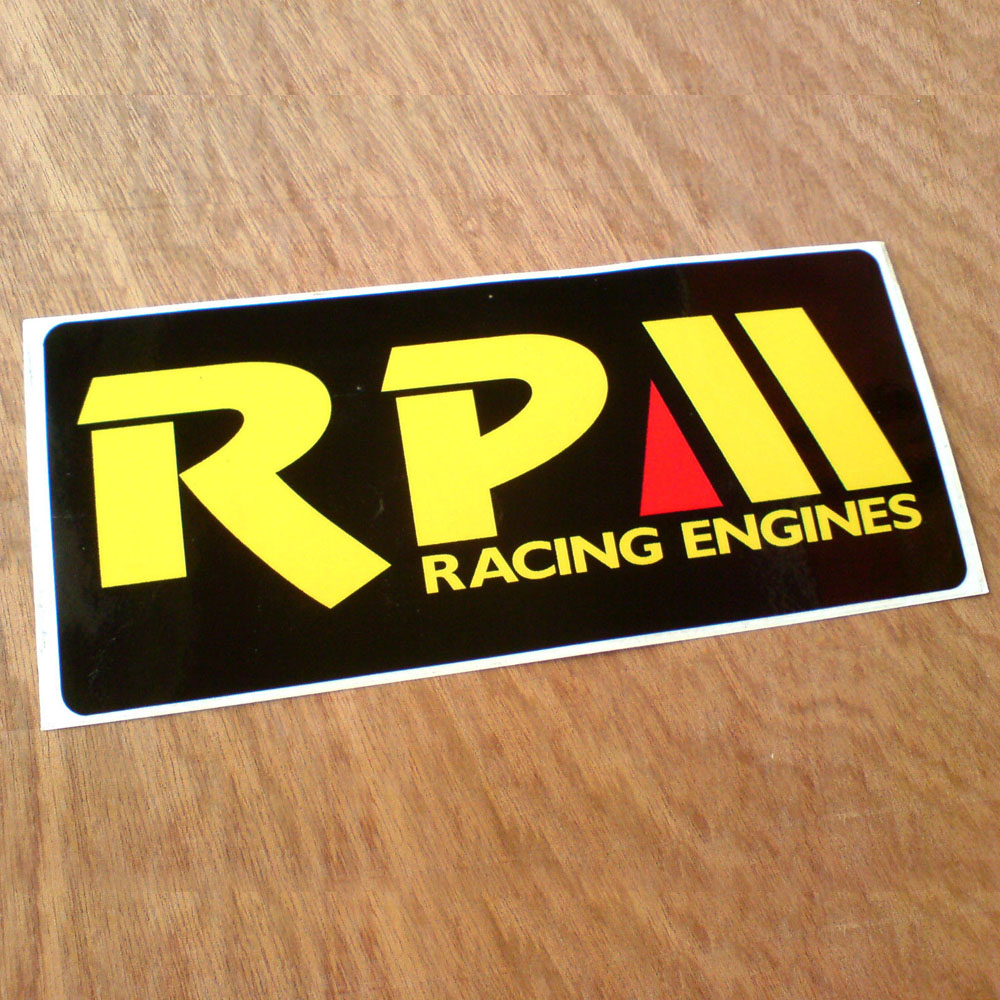 RPM Racing Engines in bold yellow lettering on a black background. Letter M is red and yellow.