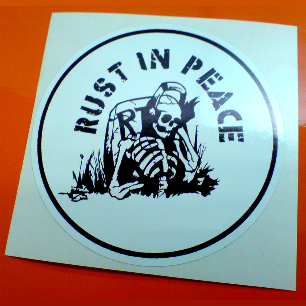 RUST IN PEACE STICKER. Rust In Peace in black lettering surrounds a black and white skeleton leaning against a gravestone partially engraved R.I.