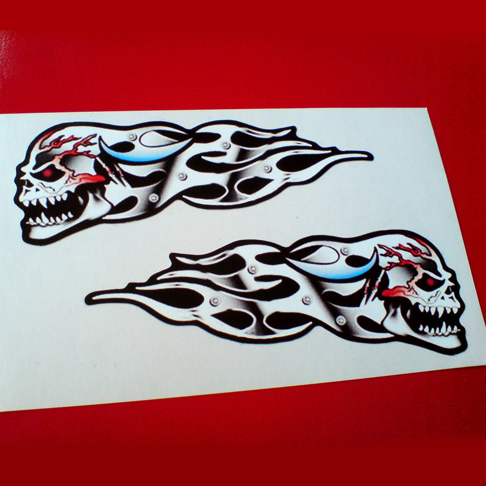 SKULL VEINS AND FLAMES HANDED STICKERS. A side view of a skull trailing metal flames. The eye is red and the head is showing red veins.