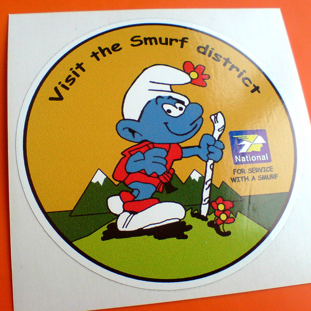 Visit the Smurf district lettering surrounds a circular sticker. A smurf with a stick wearing red and a flower in his hat is walking amongst fields and snowcapped mountains. Additional images are the National logo and For Service With A Smurf.