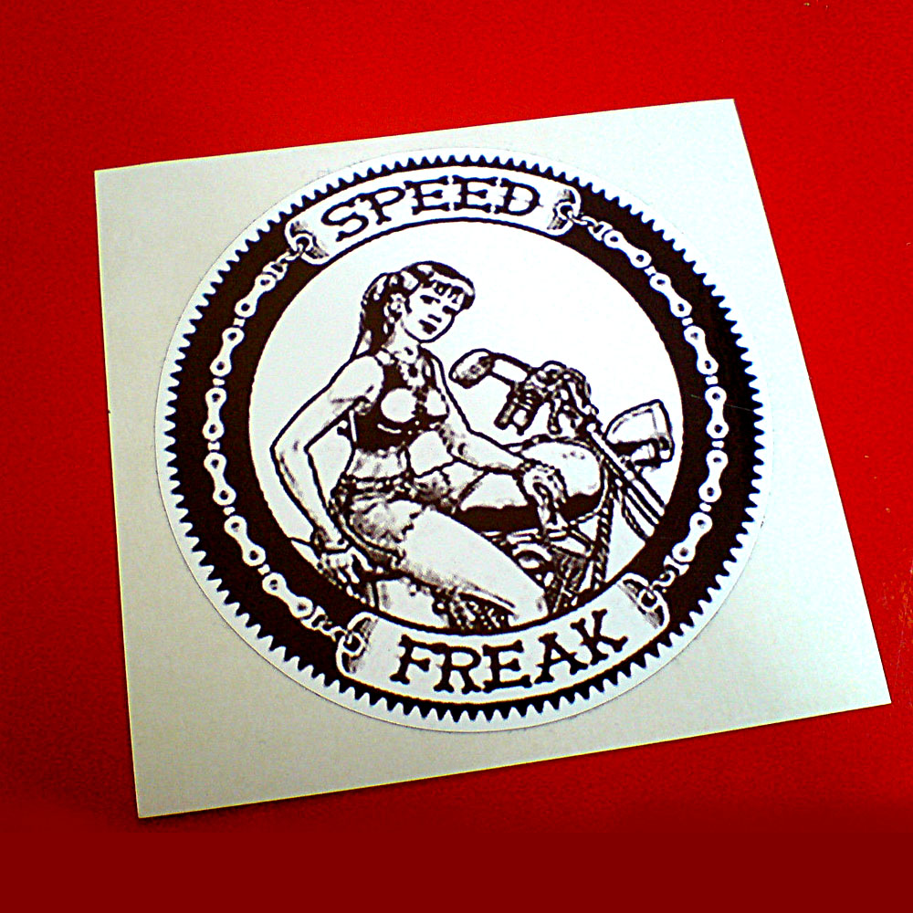 SPEED FREAK STICKER. A black and white circular sticker as a sprocket and chain. Speed Freak surrounds a girl with a ponytail wearing shorts and cropped top sat astride a motorbike.