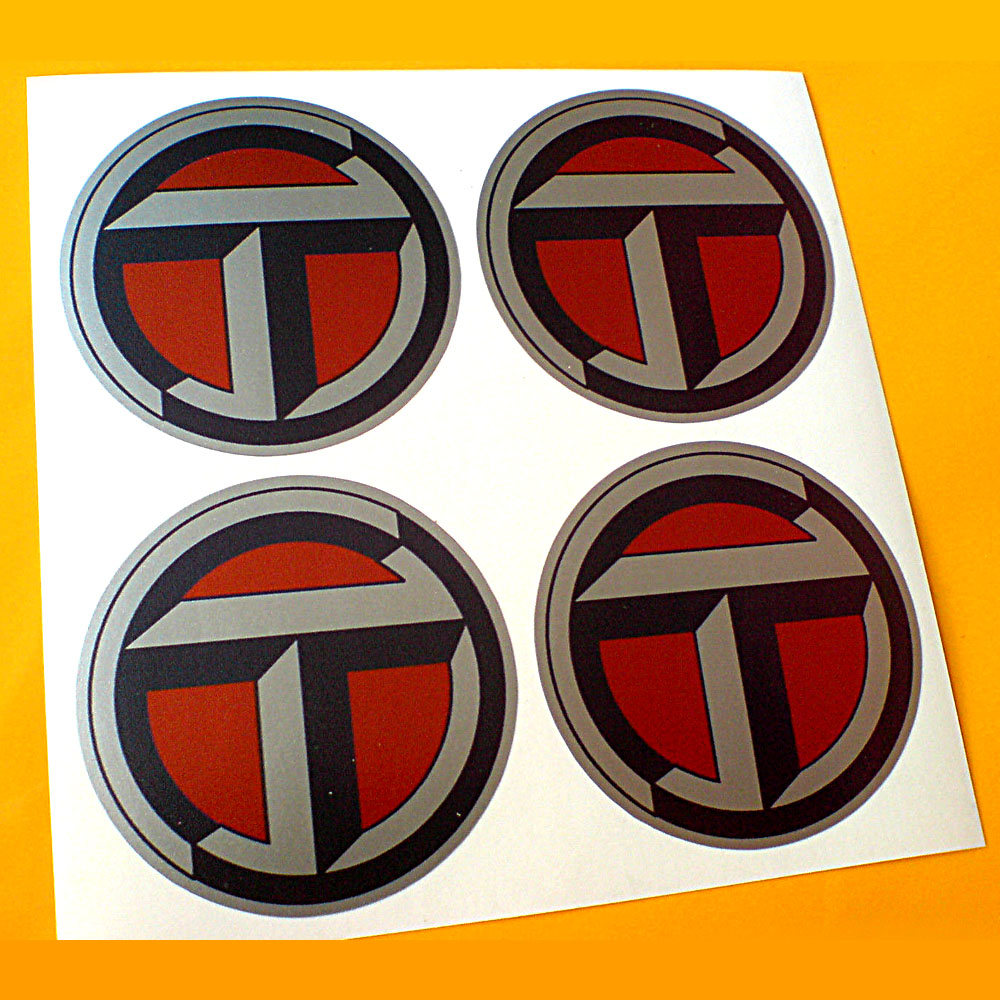A bold geometric letter T in a circular frame.