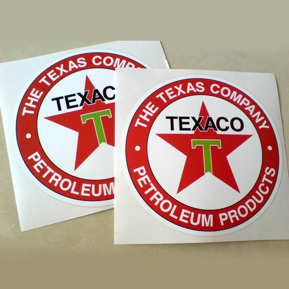 Two concentric circles. The Texas Company Petroleum Products in white lettering on a red outer circle. Texaco in black lettering and a red star with a letter T in green on it are within the white inner circle.