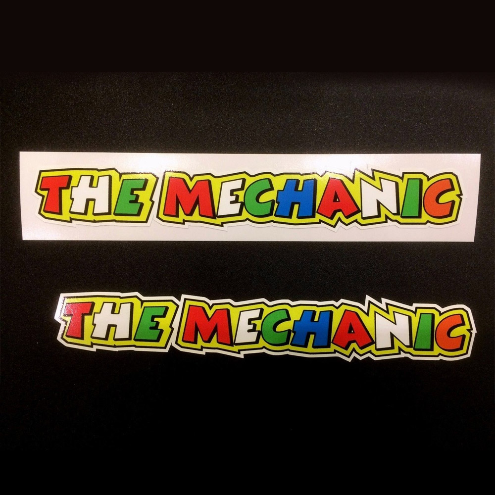 The Mechanic in bold colourful lettering. Red, white, green, blue and orange letters on a yellow background.