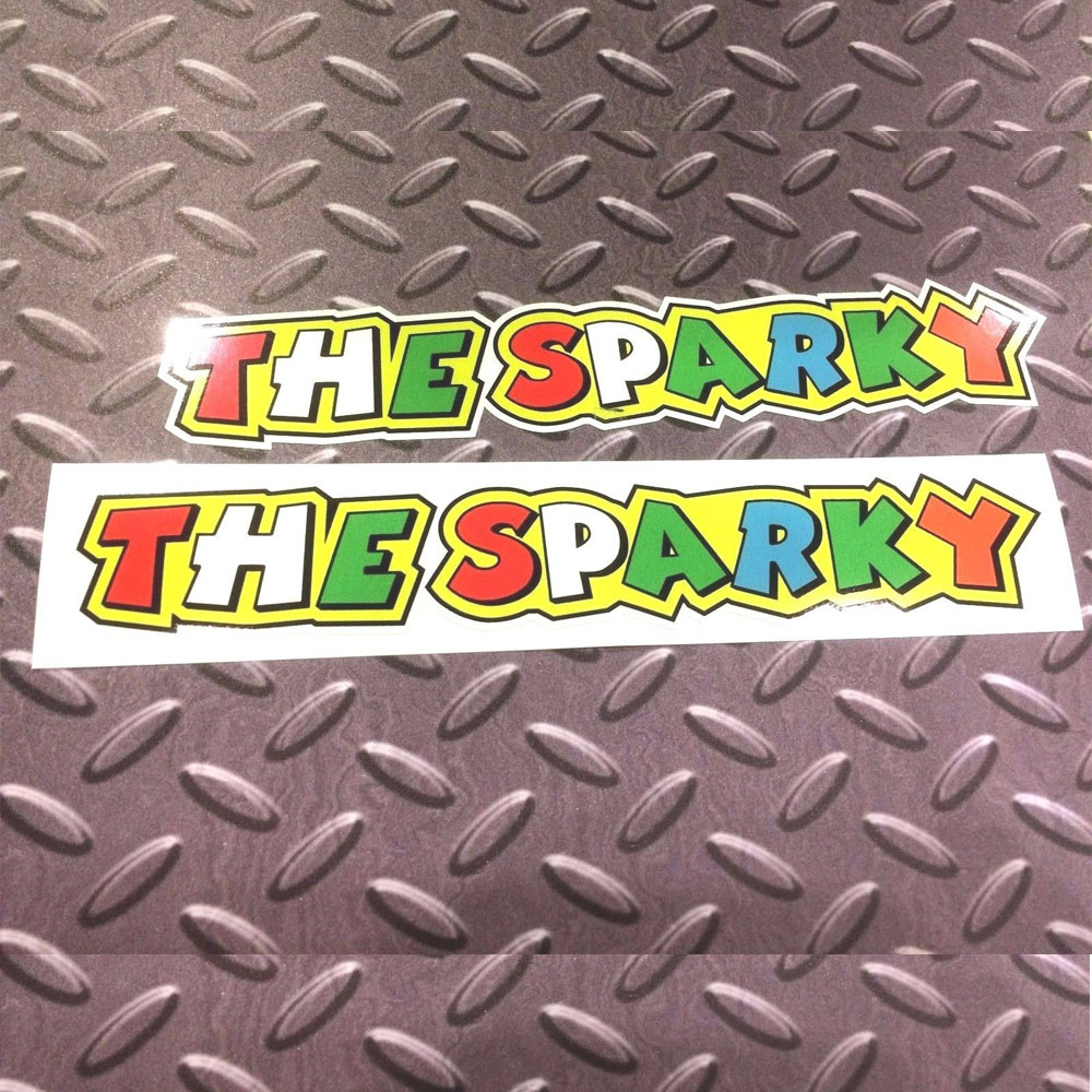 THE SPARKY ROSSI STICKERS - 2 SIZES AVAILABLE. The Sparky in bold colourful lettering. Red, white, green, blue and orange letters on a yellow background.