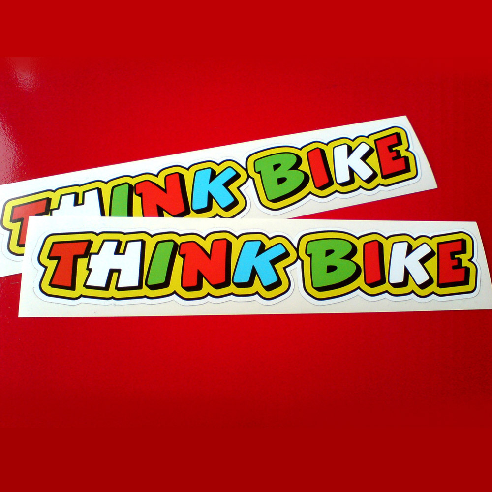 THINK BIKE STICKERS - ROSSI STYLE. Think Bike in bold uppercase lettering. Each letter is a different colour. Red, white, green and blue on a green background.