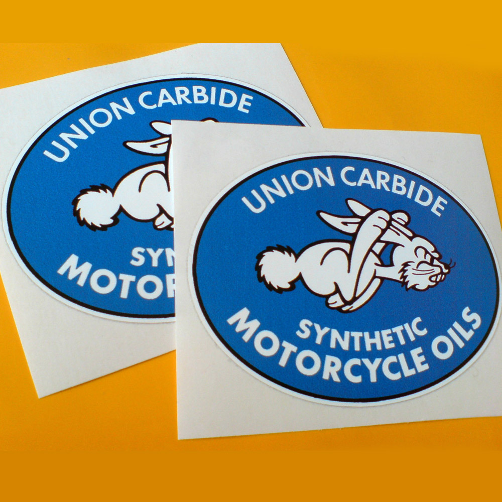 Union Carbide Synthetic Motorcycle Oils white lettering surrounds a white rabbit on the run. A blue oval shaped sticker.