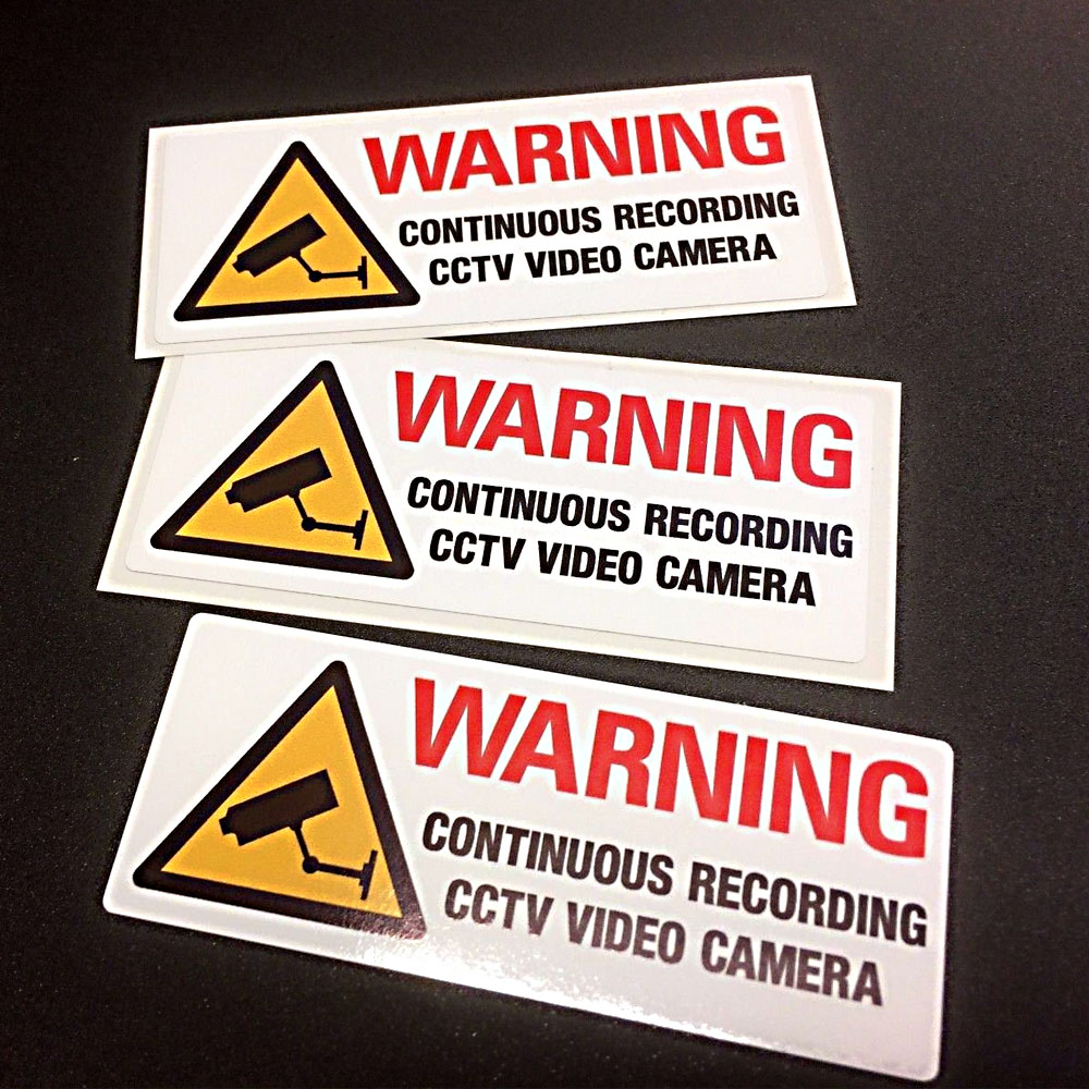 WARNING CONTINUOUS RECORDING CCTV STICKERS - SET OF 3. Warning in bold red lettering Continuous Recording CCTV Video Camera in black lettering next to a black and yellow camera warning triangle.