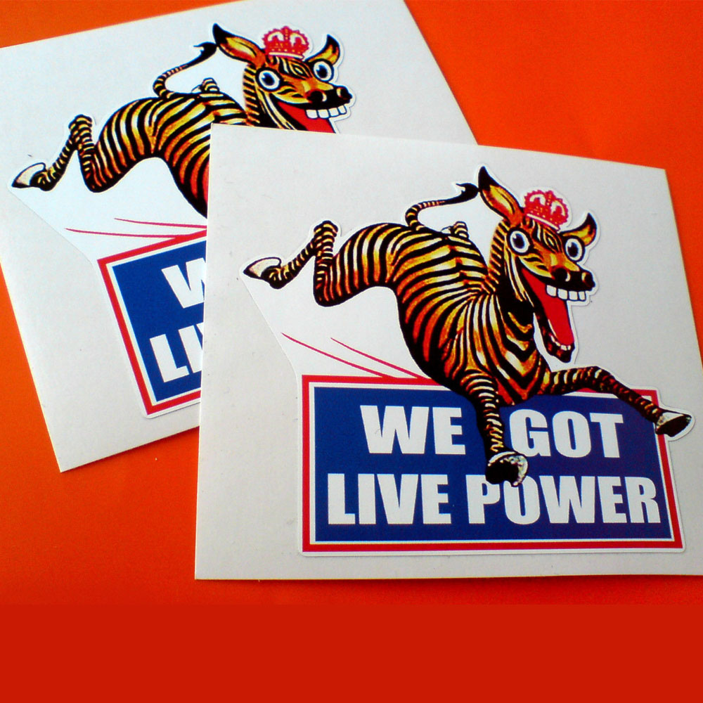 WE GOT LIVE POWER STICKERS. We Got Live Power in white lettering on a blue banner bordered in red. Above is a humorous zebra galloping wearing a red crown.