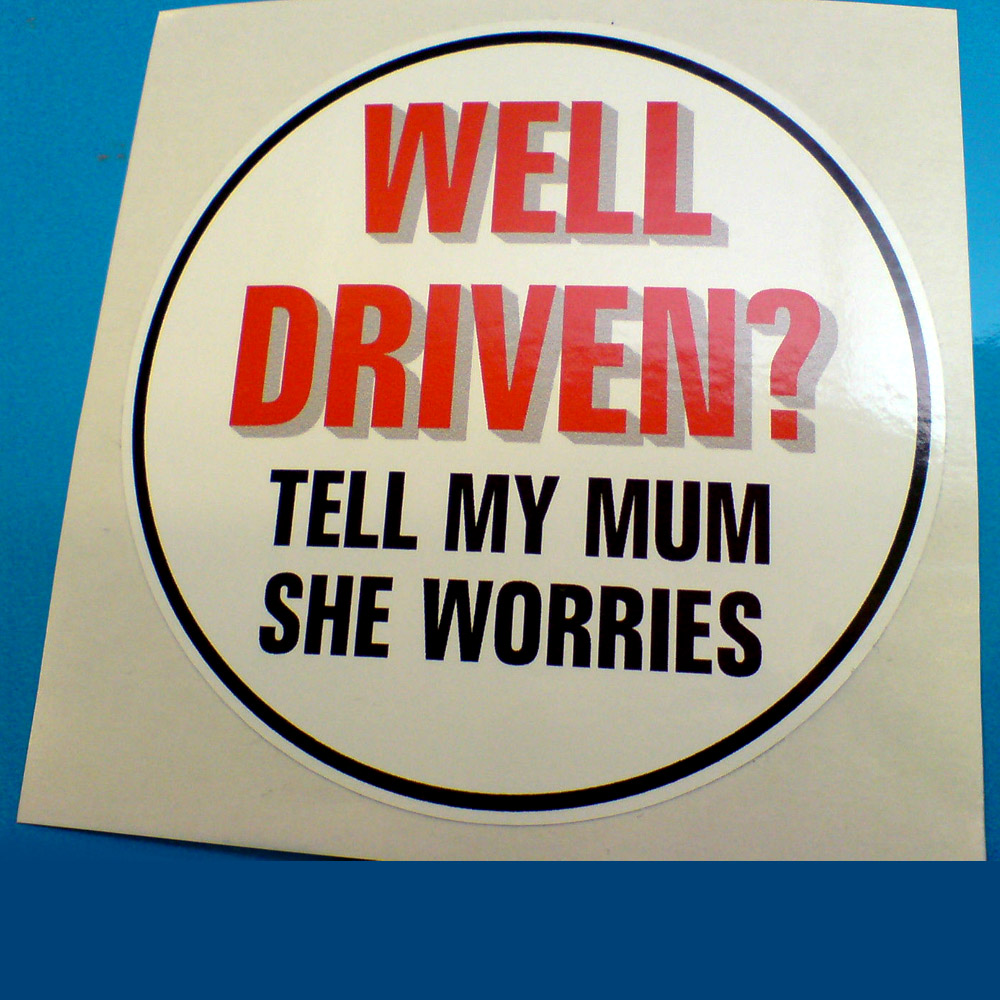 WELL DRIVEN? STICKER. Well Driven? in red uppercase lettering Tell My Mum She Worries in black uppercase lettering on a white circular sticker with a black border.