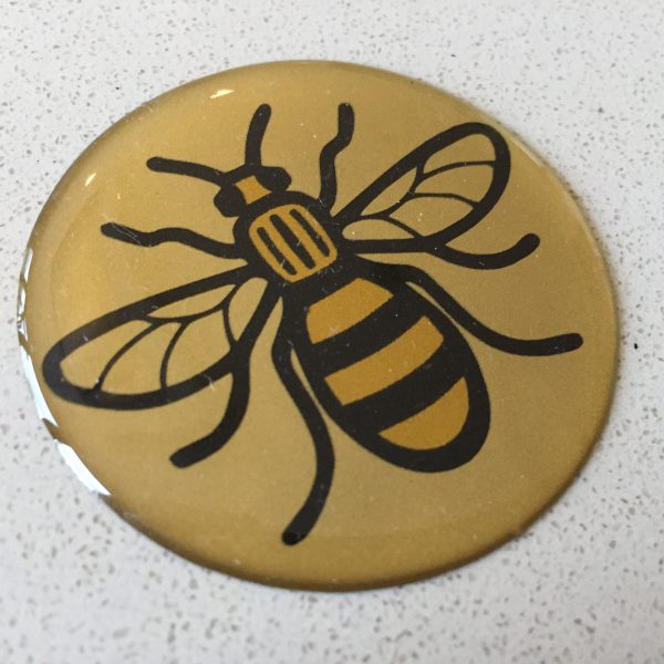 MANCHESTER BEE DOMED RESIN GEL STICKER. Black and yellow bee on a round, domed sticker.