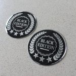 BLACK EDITION DOMED RESIN GEL STICKERS. Black Edition, stars and laurel leaf design in silver on a black background. Domed chrome effect.
