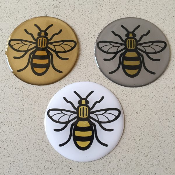 MANCHESTER BEE DOMED RESIN GEL STICKER. Black and yellow bee on a round, domed sticker.