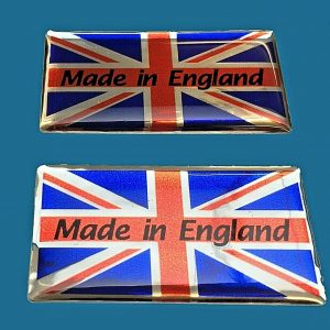 MADE IN ENGLAND UNION JACK STICKERS DOMED RESIN GEL. Union Jack in vibrant red, white and blue. Made in England black lowercase lettering on red across the centre. Chrome effect.