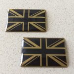UNION JACK DOMED RESIN GEL STICKERS. A domed chrome effect Union Jack in black and silver or black and gold.