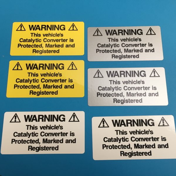 CATALYTIC CONVERTER WARNING STICKERS. Catalytic Convertor Warning Stickers. Black text on either a yellow, white or silver background. With the word Warning in bold capital letters. The rest of the text 'This vehicle's Catalytic Converter is Protected, Marked and Registered' in lower case.