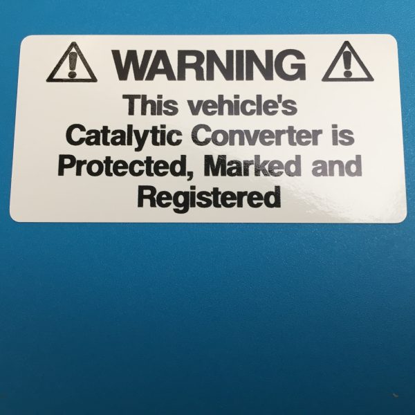 WARNING! CATALYTIC CONVERTER STICKERS. Catalytic Convertor Warning Stickers. Black text on either a yellow, white or silver background. With the word Warning in bold capital letters. The rest of the text 'This vehicle's Catalytic Converter is Protected, Marked and Registered' in lower case.