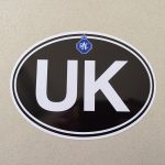 UK in bold white lettering on a black background. RAC classic blue and white logo above.