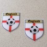 ENGLAND ST GEORGE FOOTBALL. St George cross with football in centre. Word England written at the top.